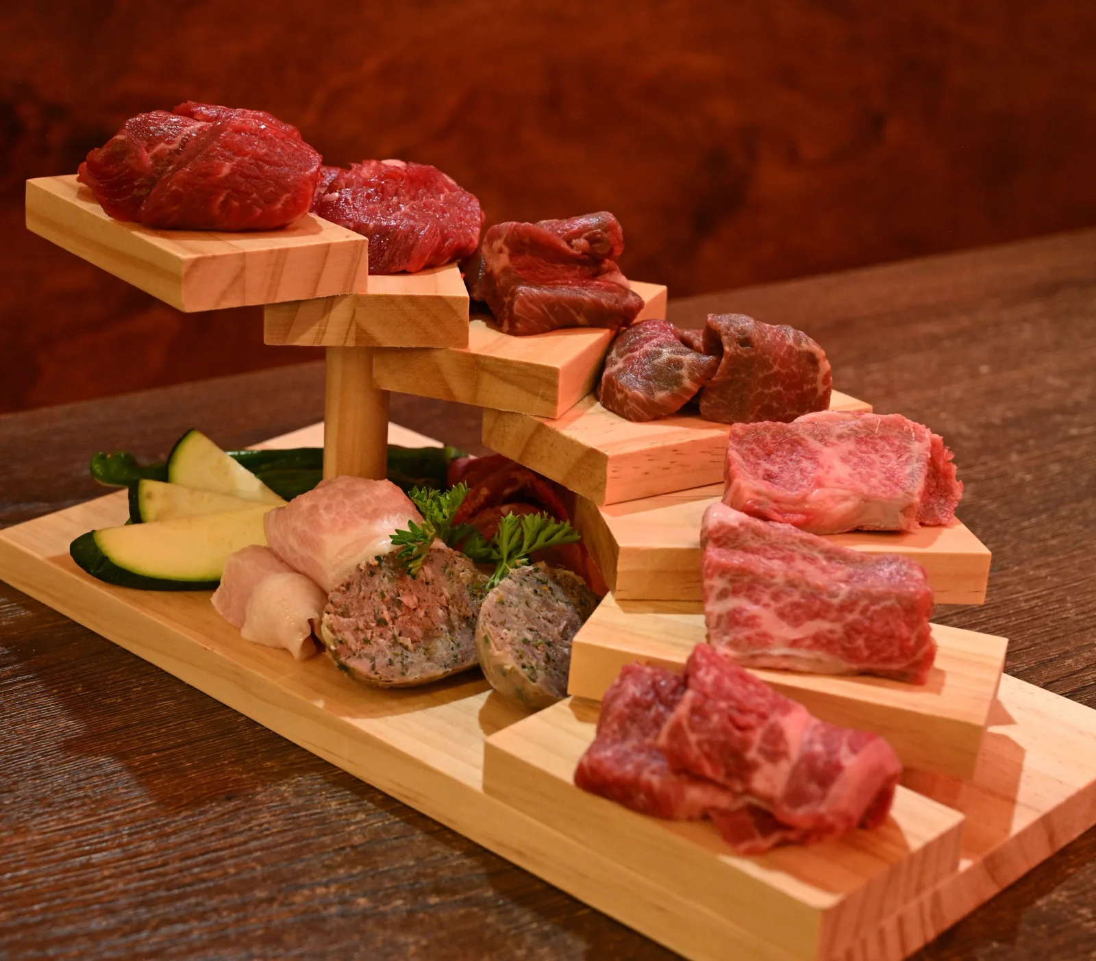 Tiered stand of premium raw wagyu cuts — the fire side