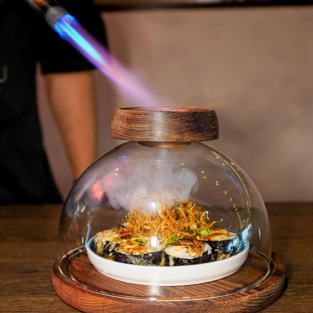 HIMIZU red neon sign over the sushi counter