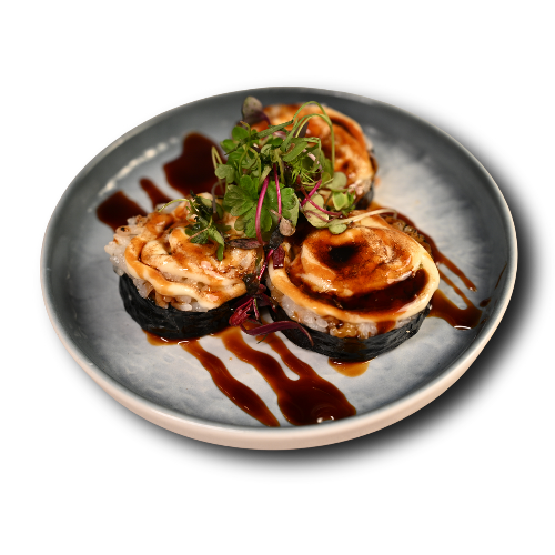 Torched sushi roll with sauce drizzle